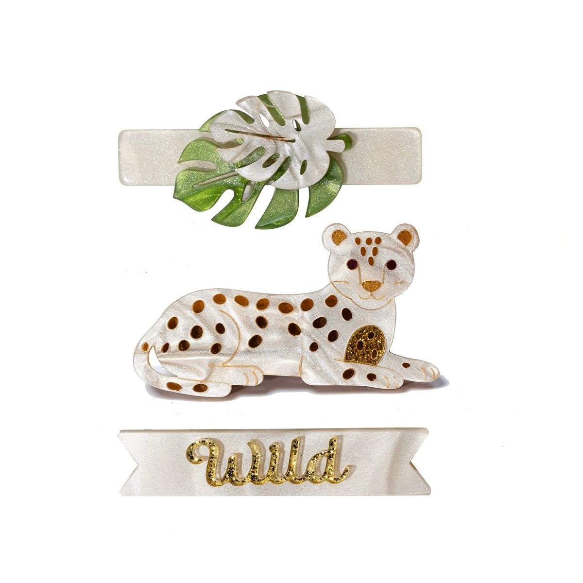 Leopard-themed hair clip with green leaf and 'Wild' banner on a white background