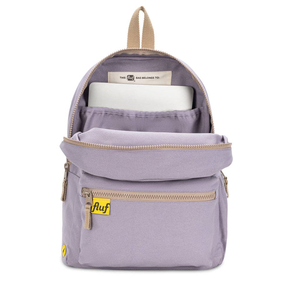 Purple backpack with a laptop inside on a white background