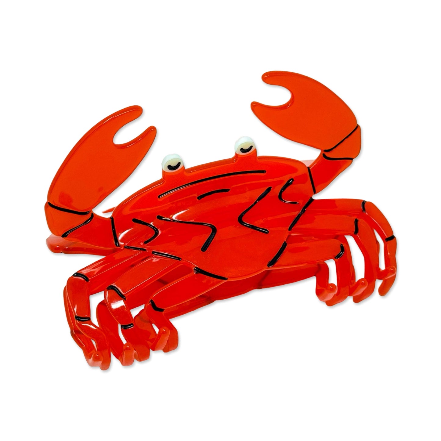 Red crab-shaped hair claw on a white background