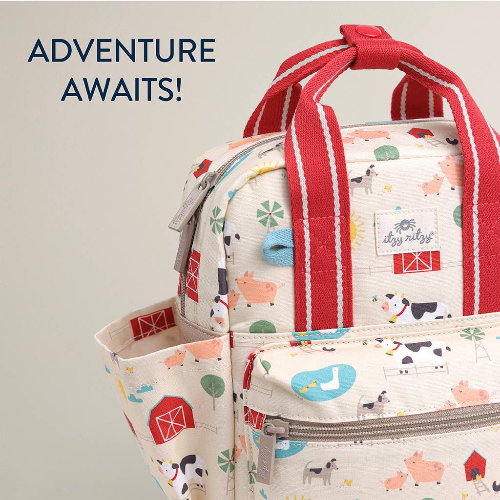 Children's backpack with farm animal pattern and red straps on a light gray background