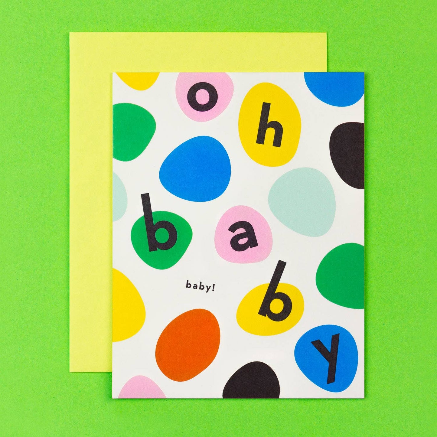 Colorful polka dot card with 'oh baby!' text on a green background