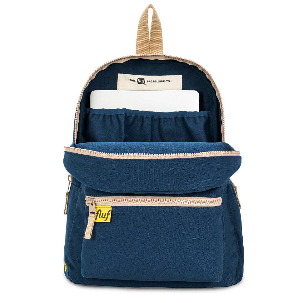 Blue backpack with beige accents on a white background