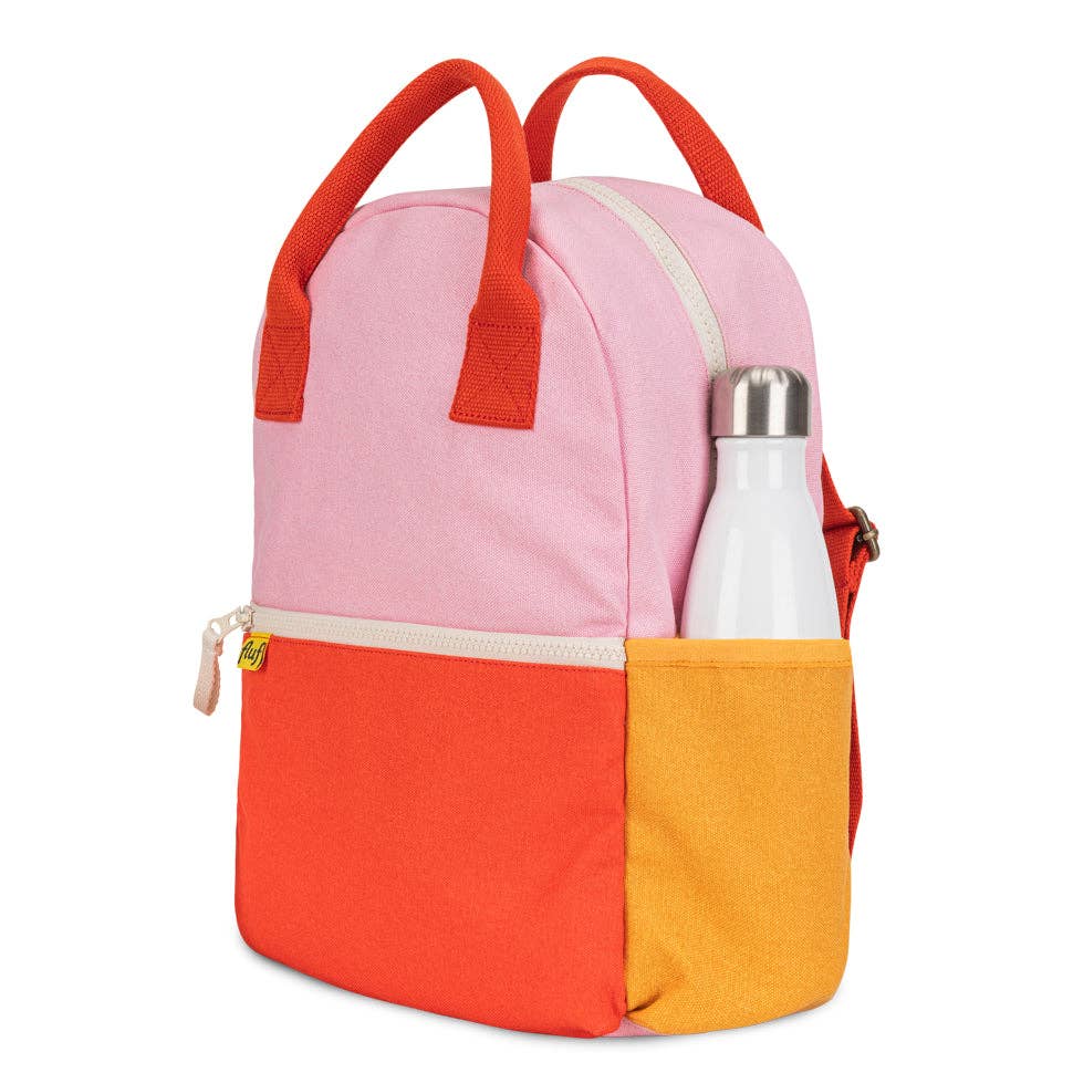 Color-blocked backpack with pink, orange, and yellow sections on a white background