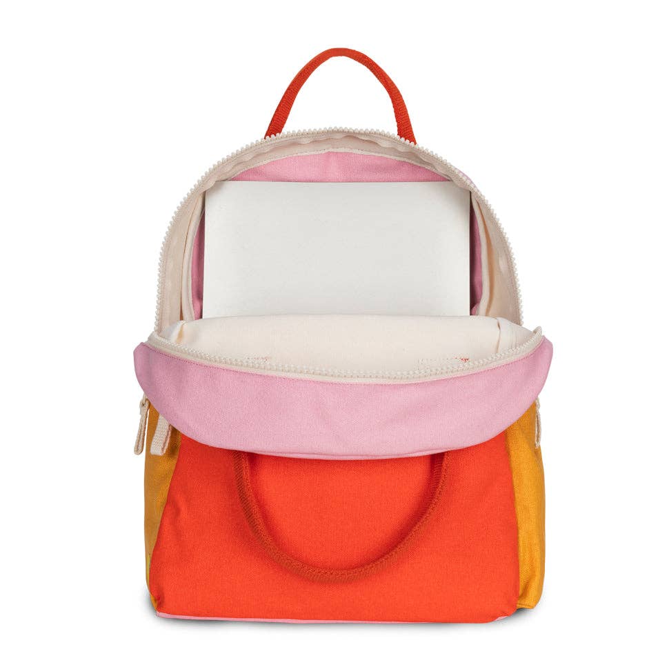 Colorful backpack with pink, orange, and yellow sections on a white background