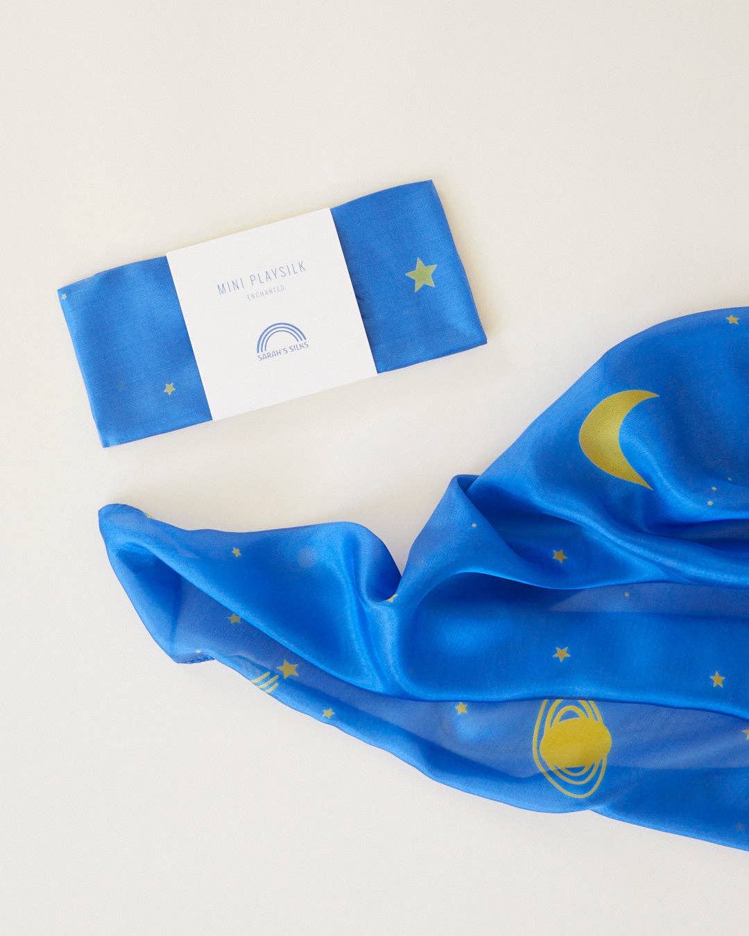 Blue scarf with yellow designs on a white background