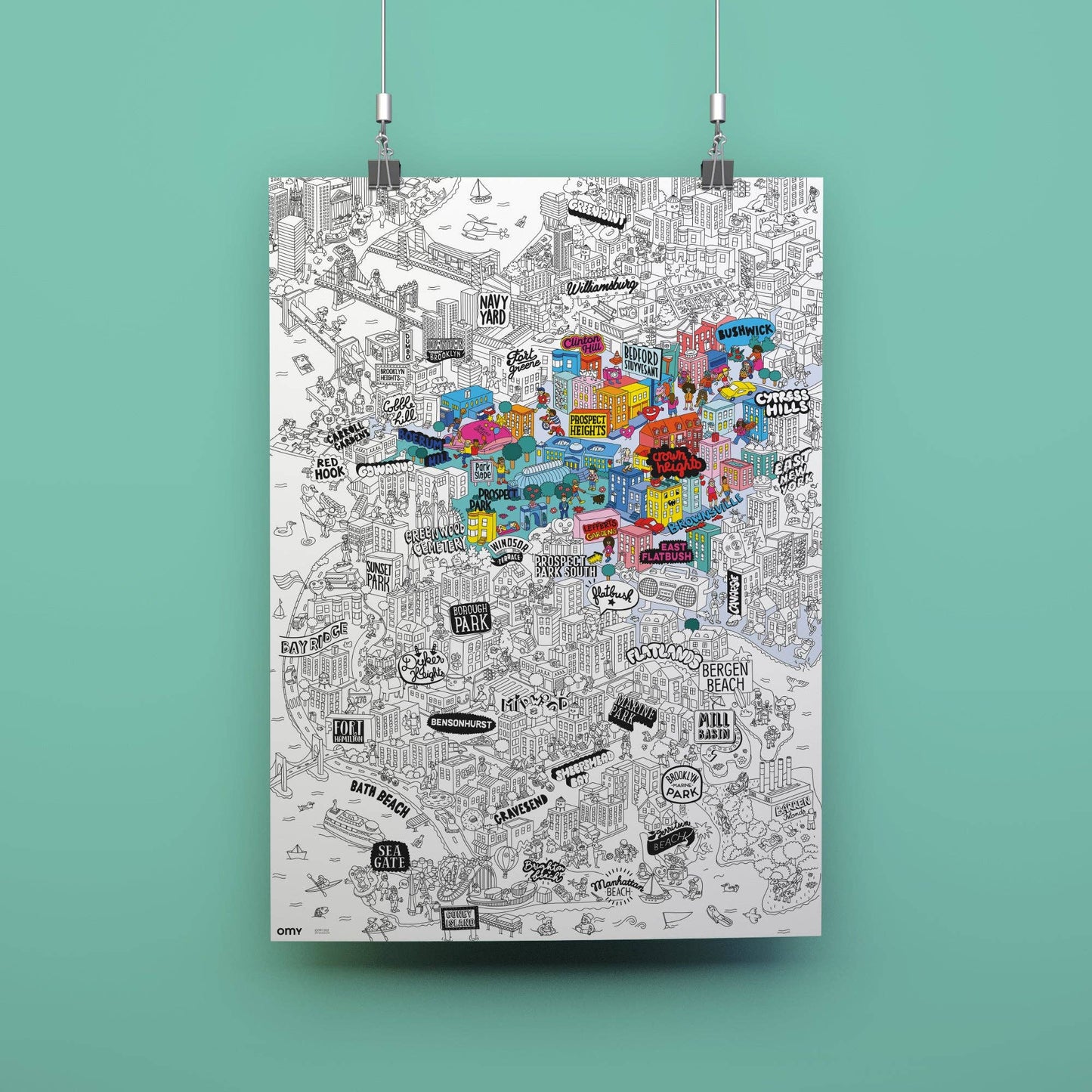 Colorful map poster hanging on a turquoise wall