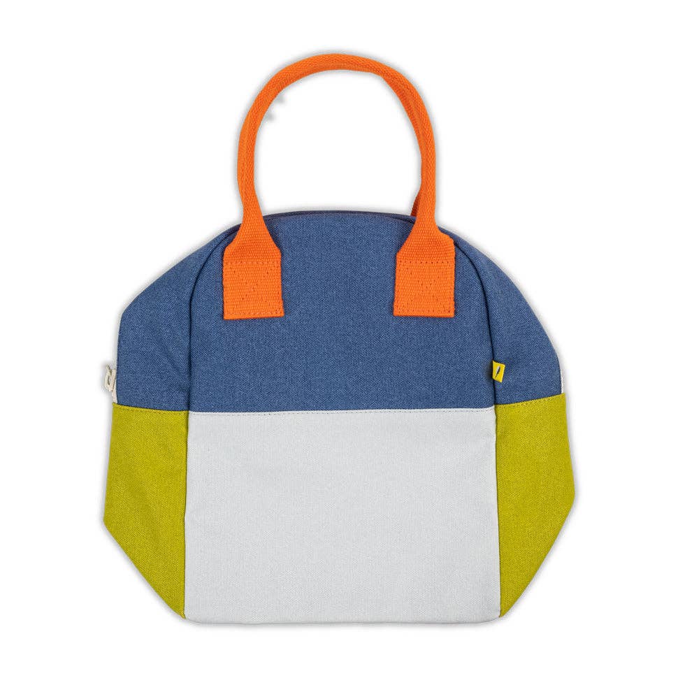 Color-blocked bag with orange handles on a white background