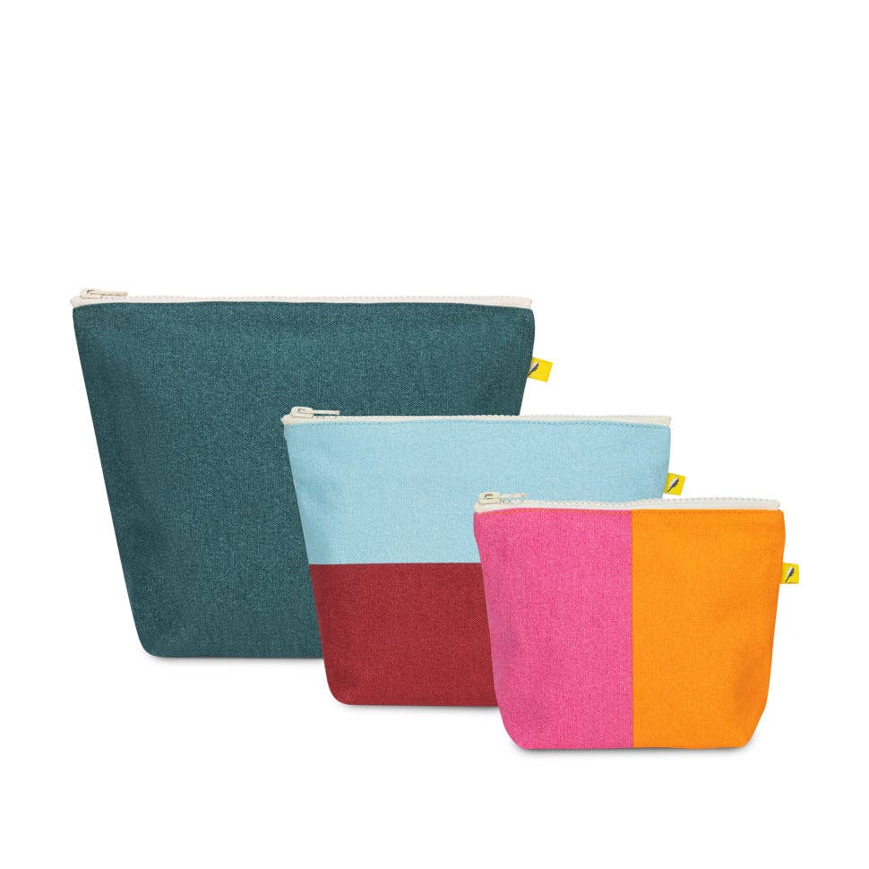 Three colorful pouches with zippers on a white background