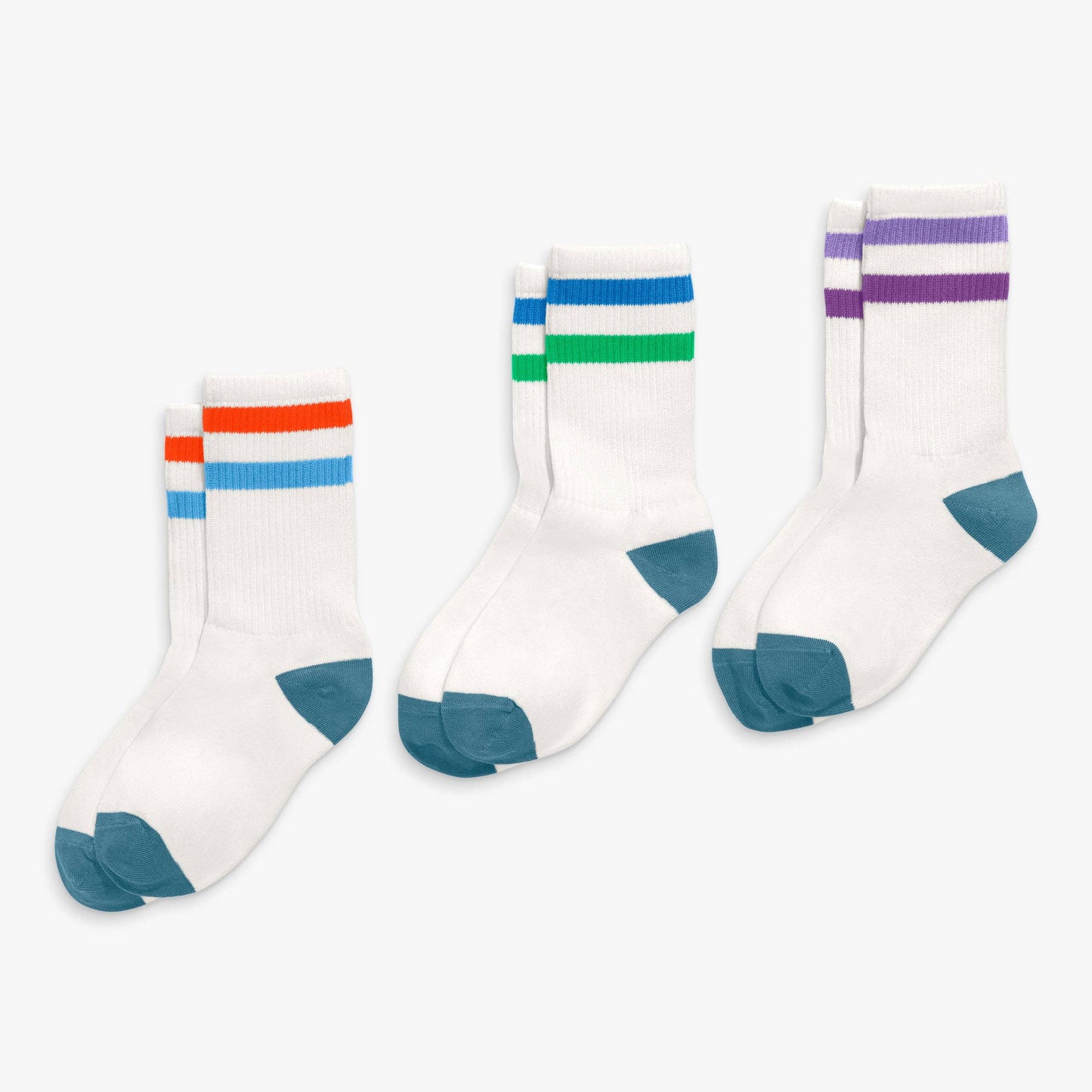 Three pairs of socks with colorful stripes on a white background