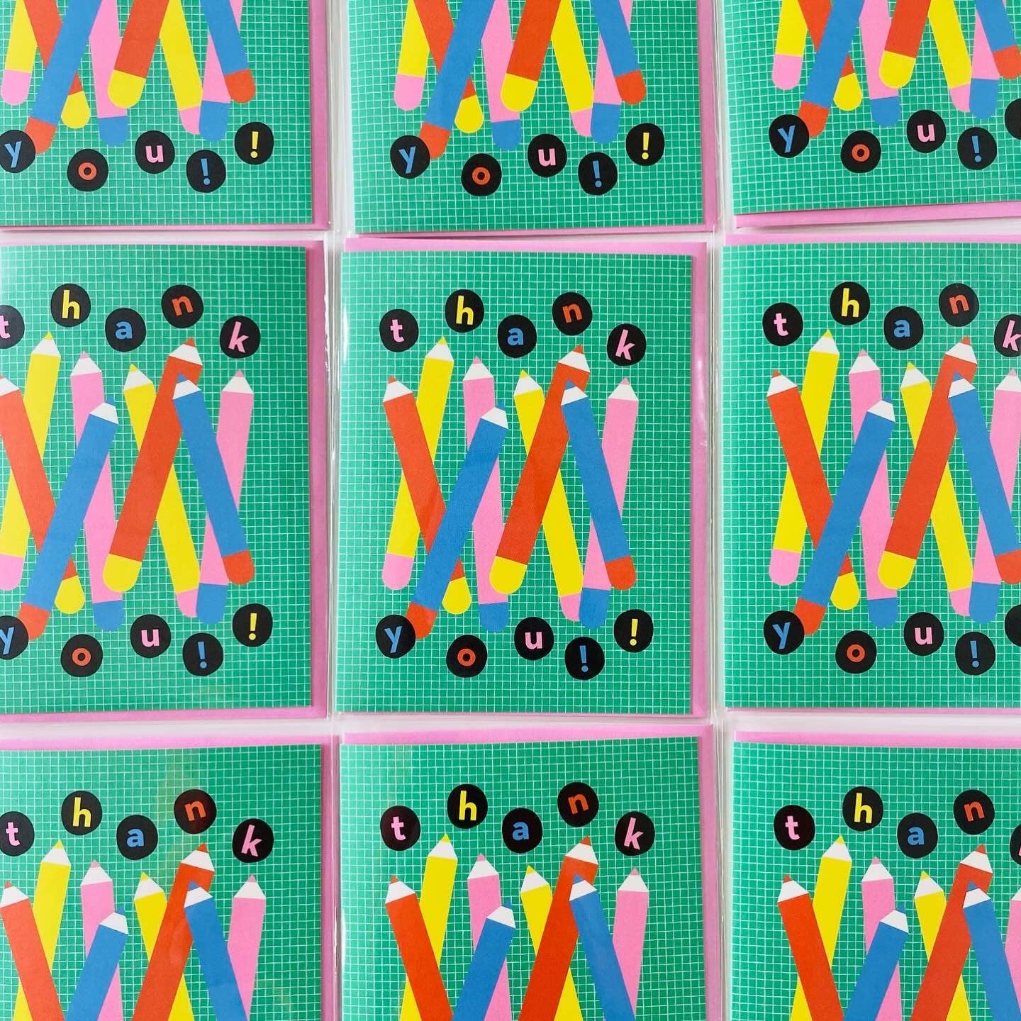 Grid of 'Thank You!' cards with colorful pencils on a green checkered background