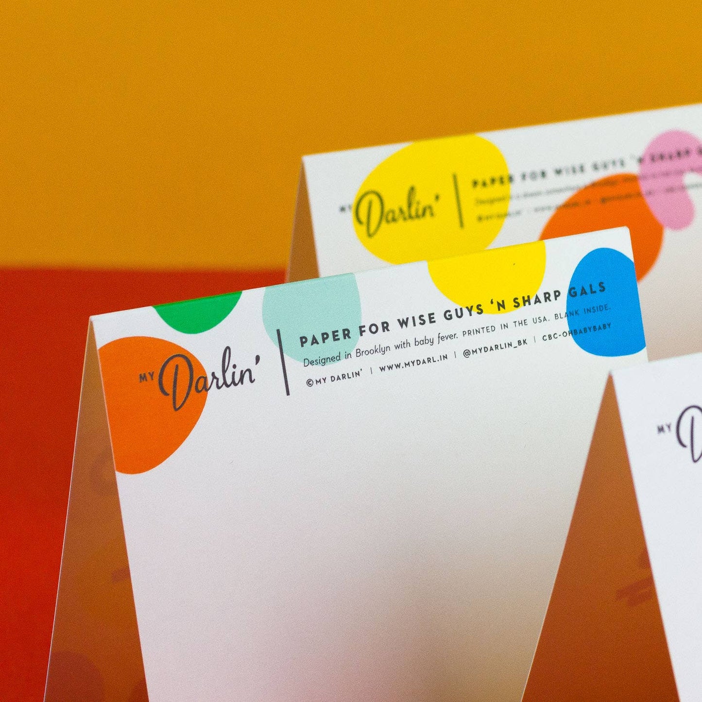Colorful stationery items with 'My Darlin' branding on a gradient background