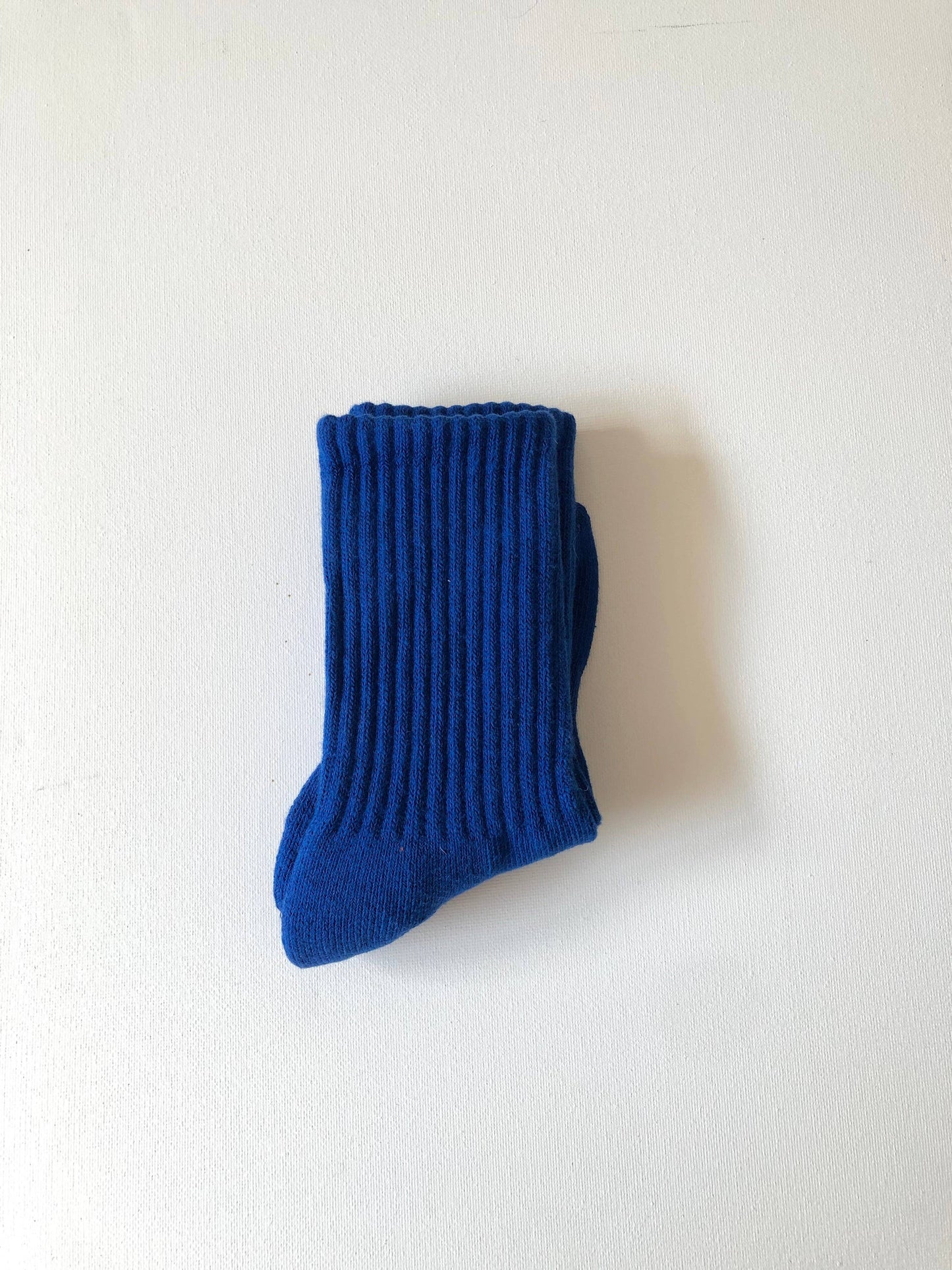 Blue sock on a white background