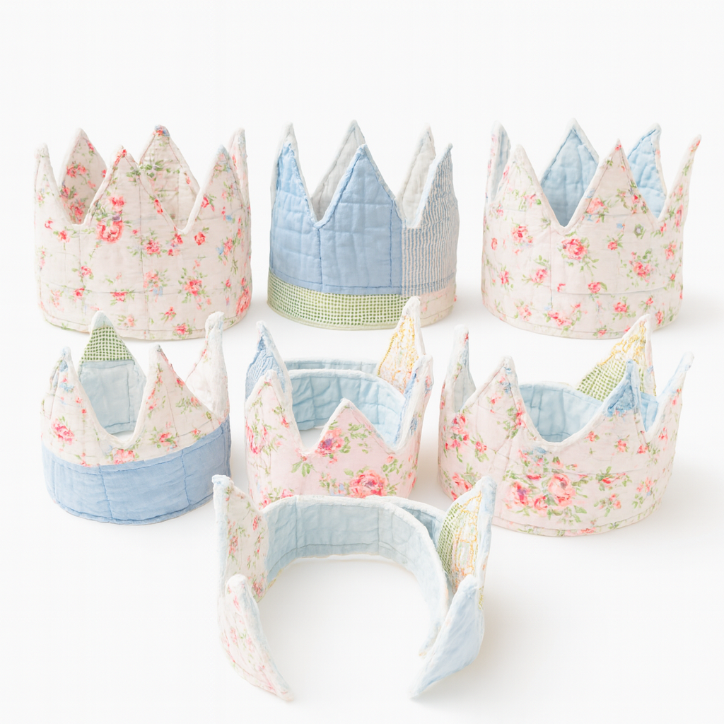 Set of fabric crowns with floral and solid patterns on a white background