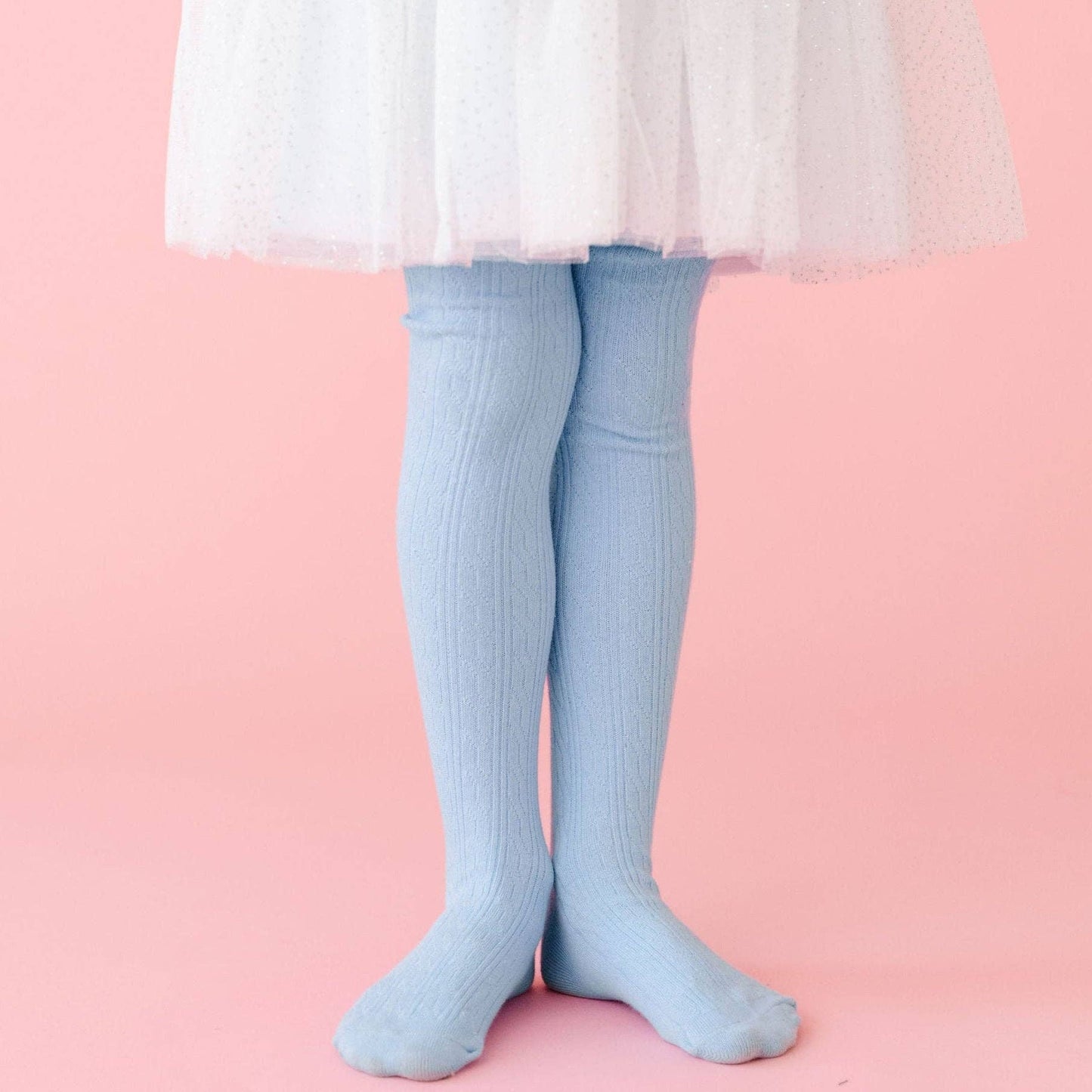 Little Stocking Co. Winter Blue Cable Knit Tights on a child model