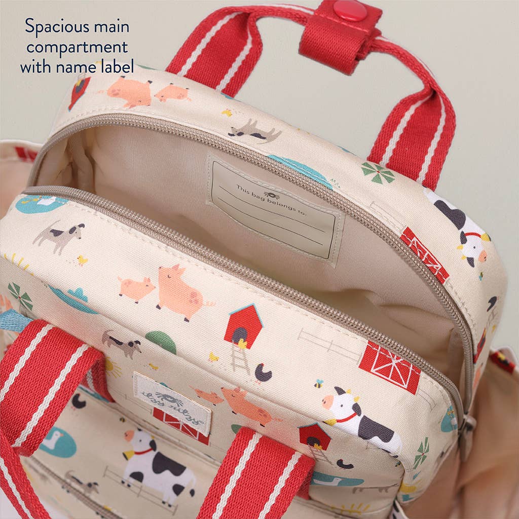 Backpack with farm animal pattern and red straps, showing a spacious main compartment.