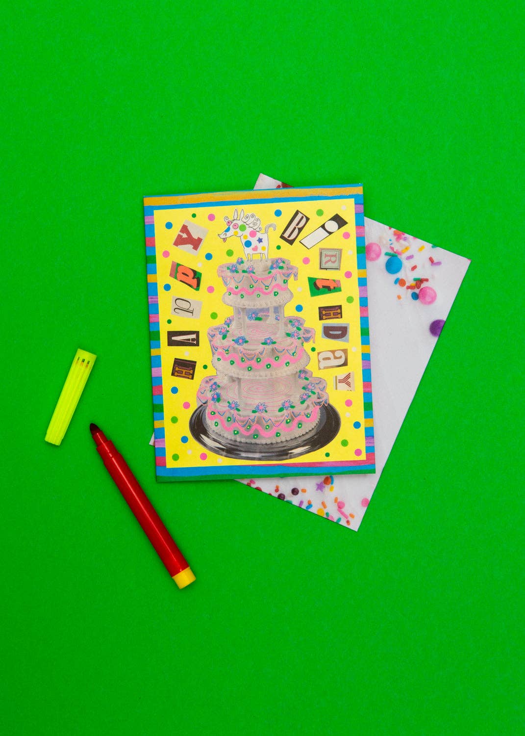 Colorful greeting card with a cake design on a green background