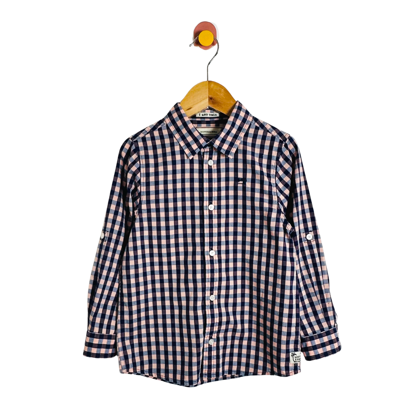 Checkered shirt on a hanger against a white background