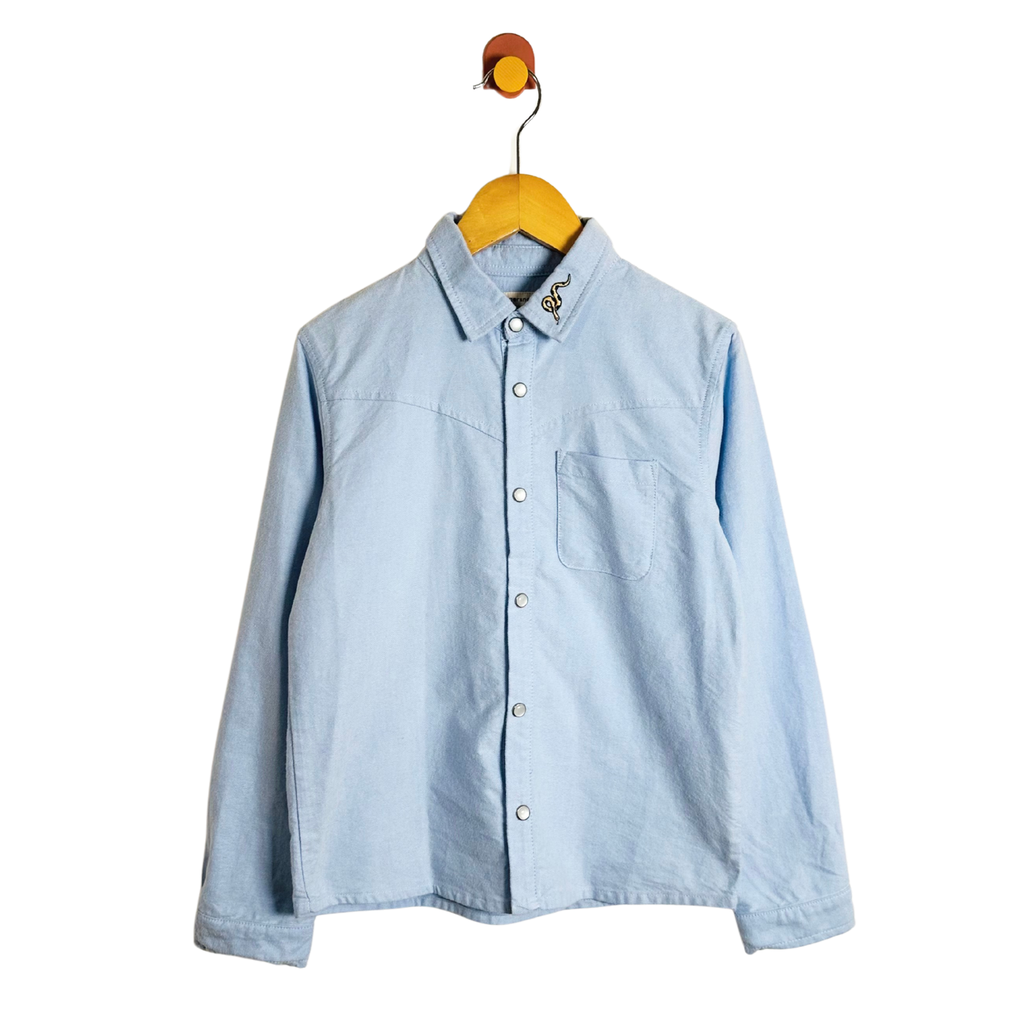 Light blue shirt on a yellow hanger against a white background