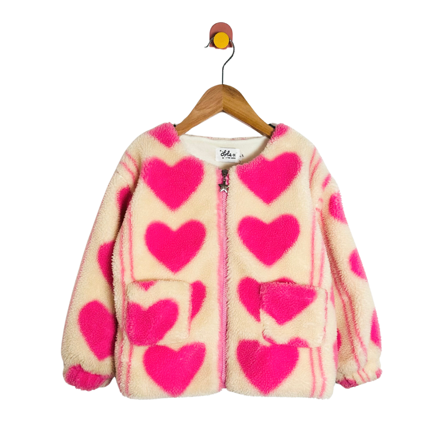 Children's jacket with pink heart patterns on a white background