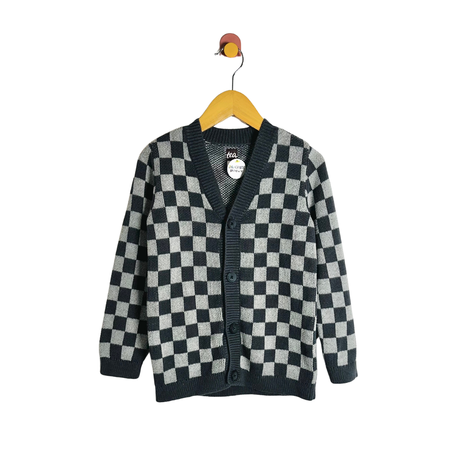 Checkered cardigan on a hanger against a white background