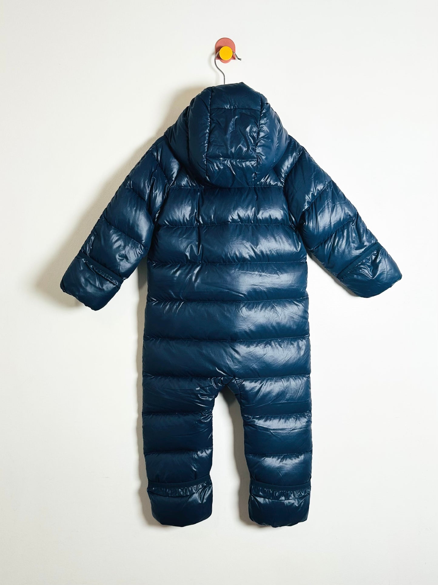 Blue puffer snowsuit on a white background