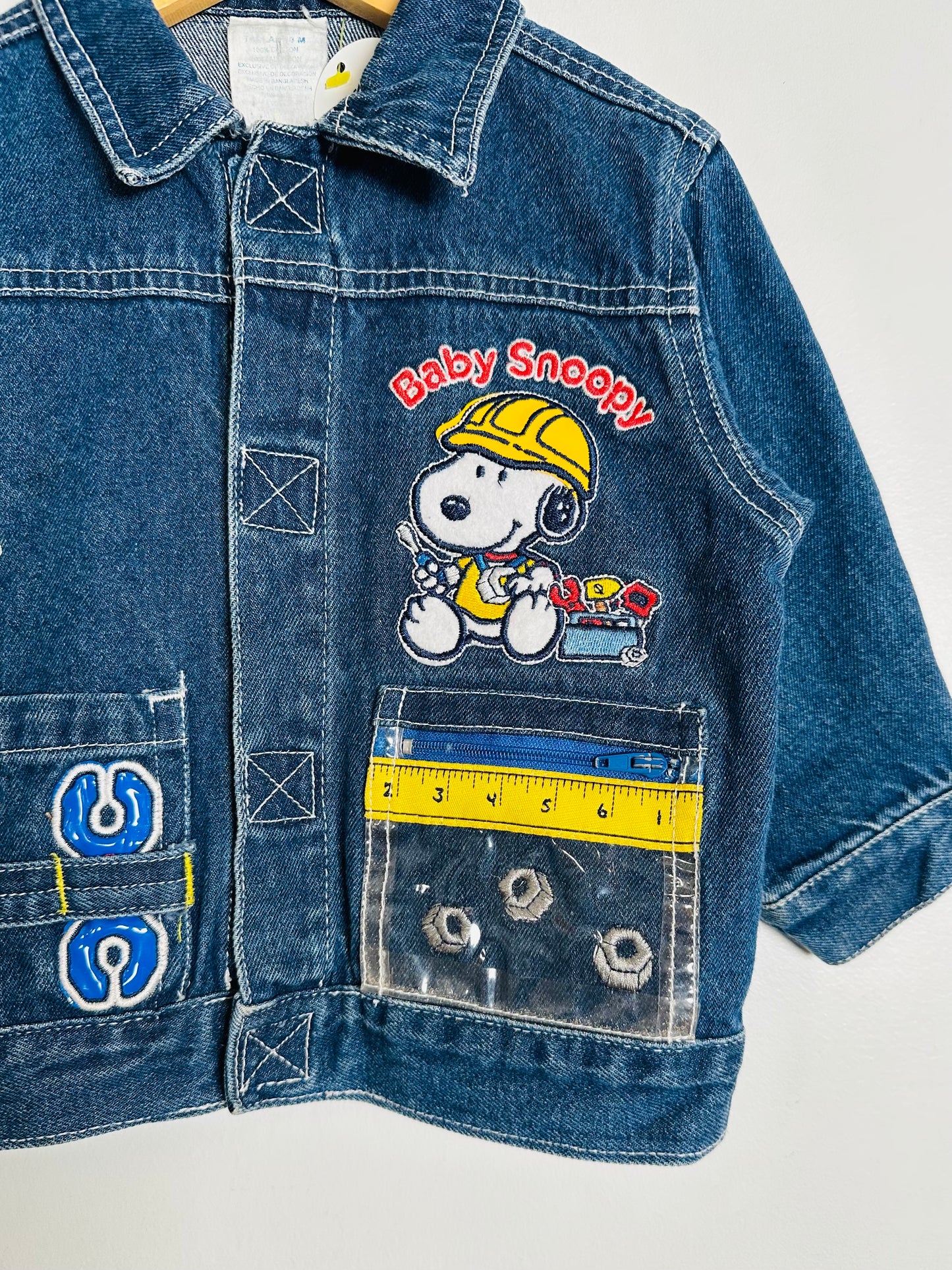 Blue denim jacket with 'Baby Snoopy' design on a white background