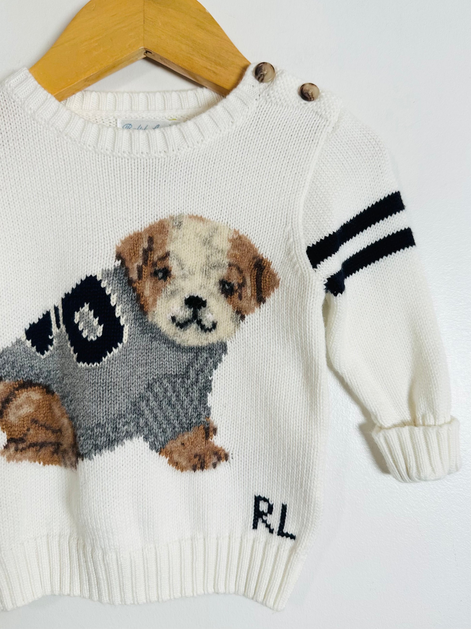 Children's sweater with a dog design and 'RL' branding on a white background