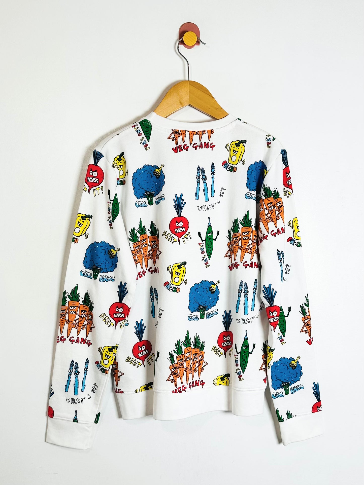 White sweatshirt with colorful graphic design on a white background