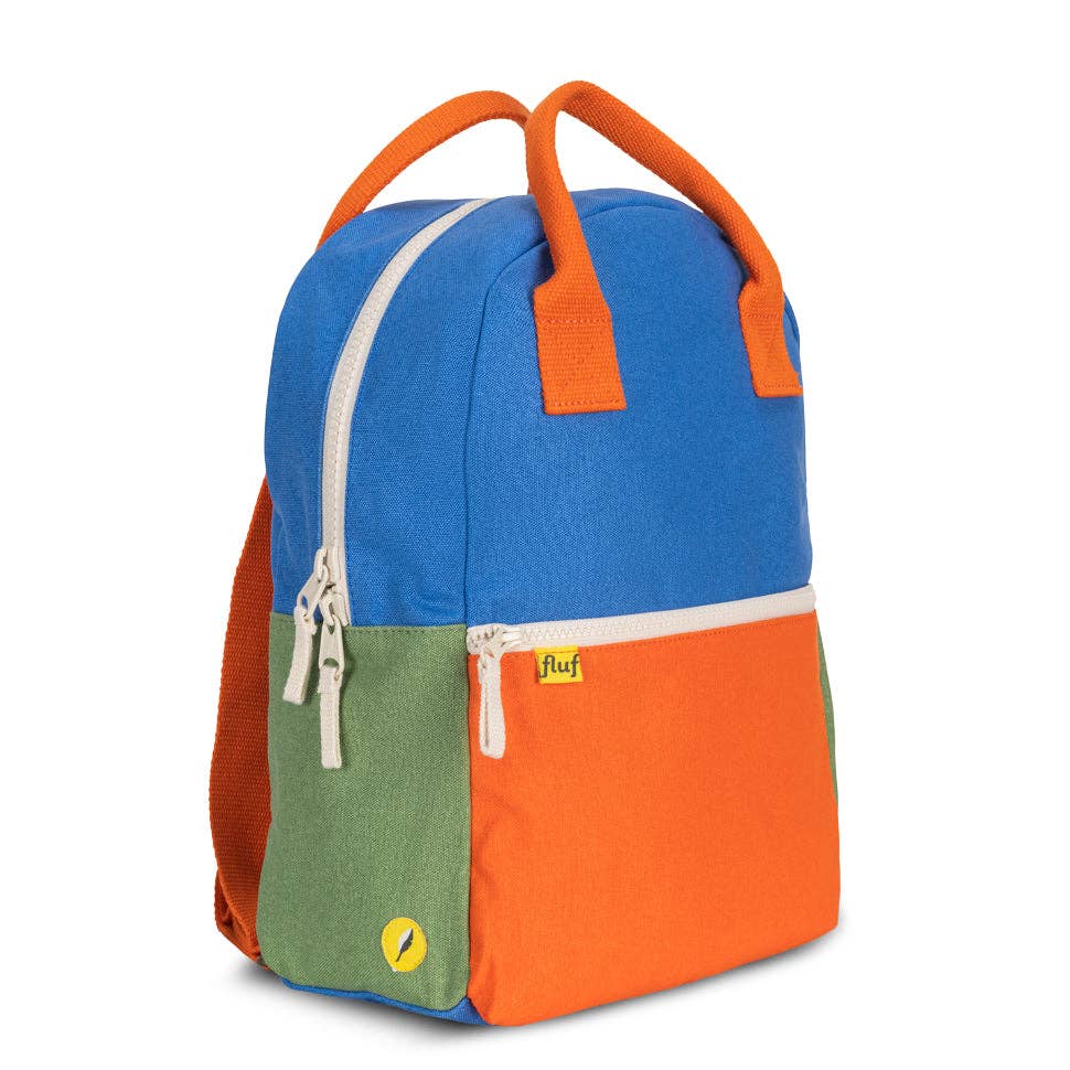 Colorful backpack with blue, orange, and green sections on a white background