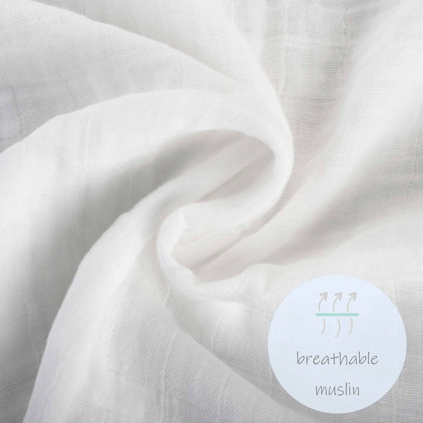 Close-up of breathable muslin fabric with a label indicating its material.