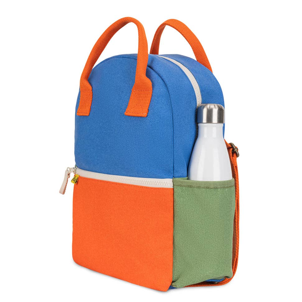 Color-blocked backpack with orange, blue, and green sections on a white background
