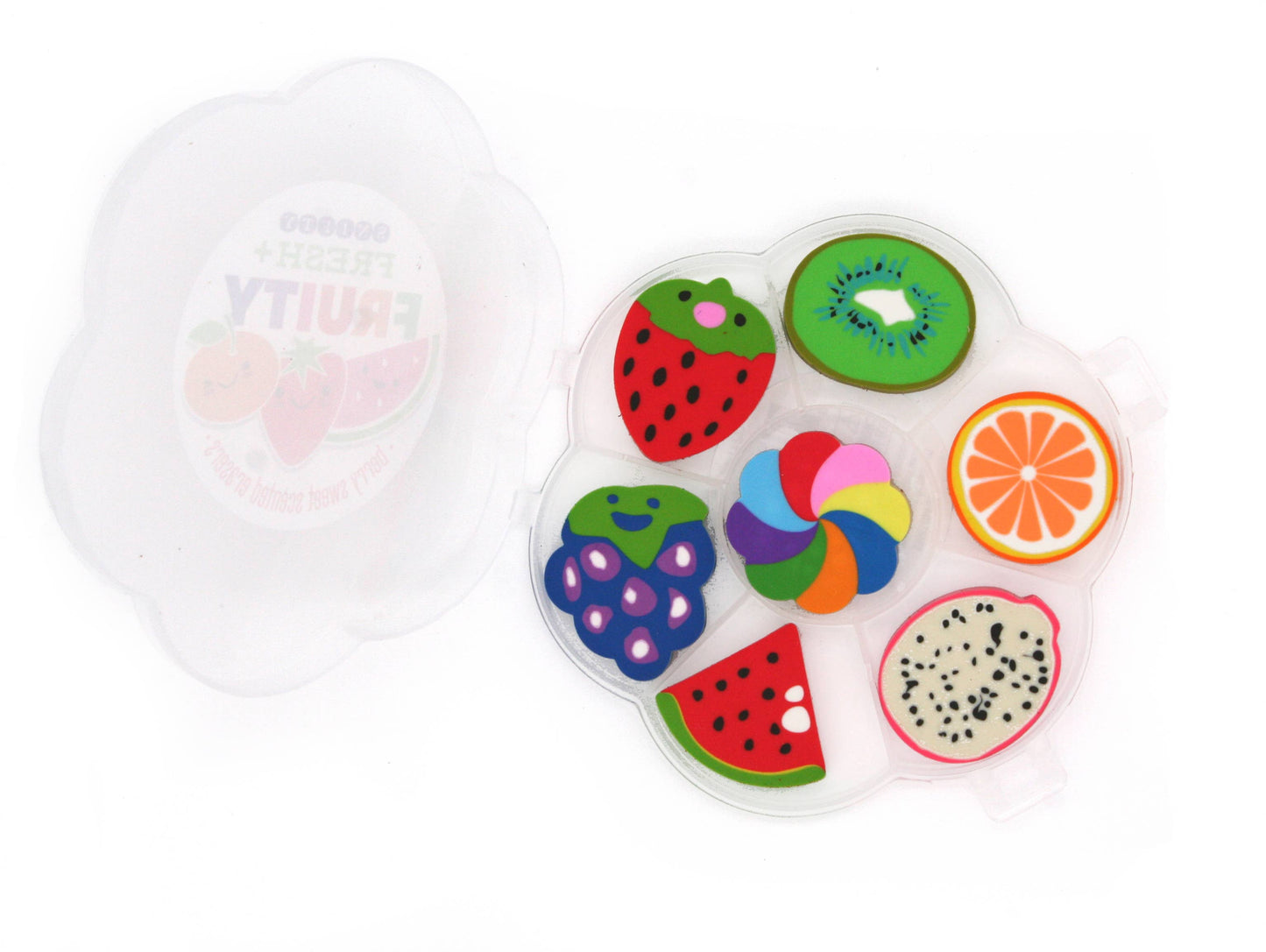 Colorful fruit-shaped erasers in a transparent container on a white background