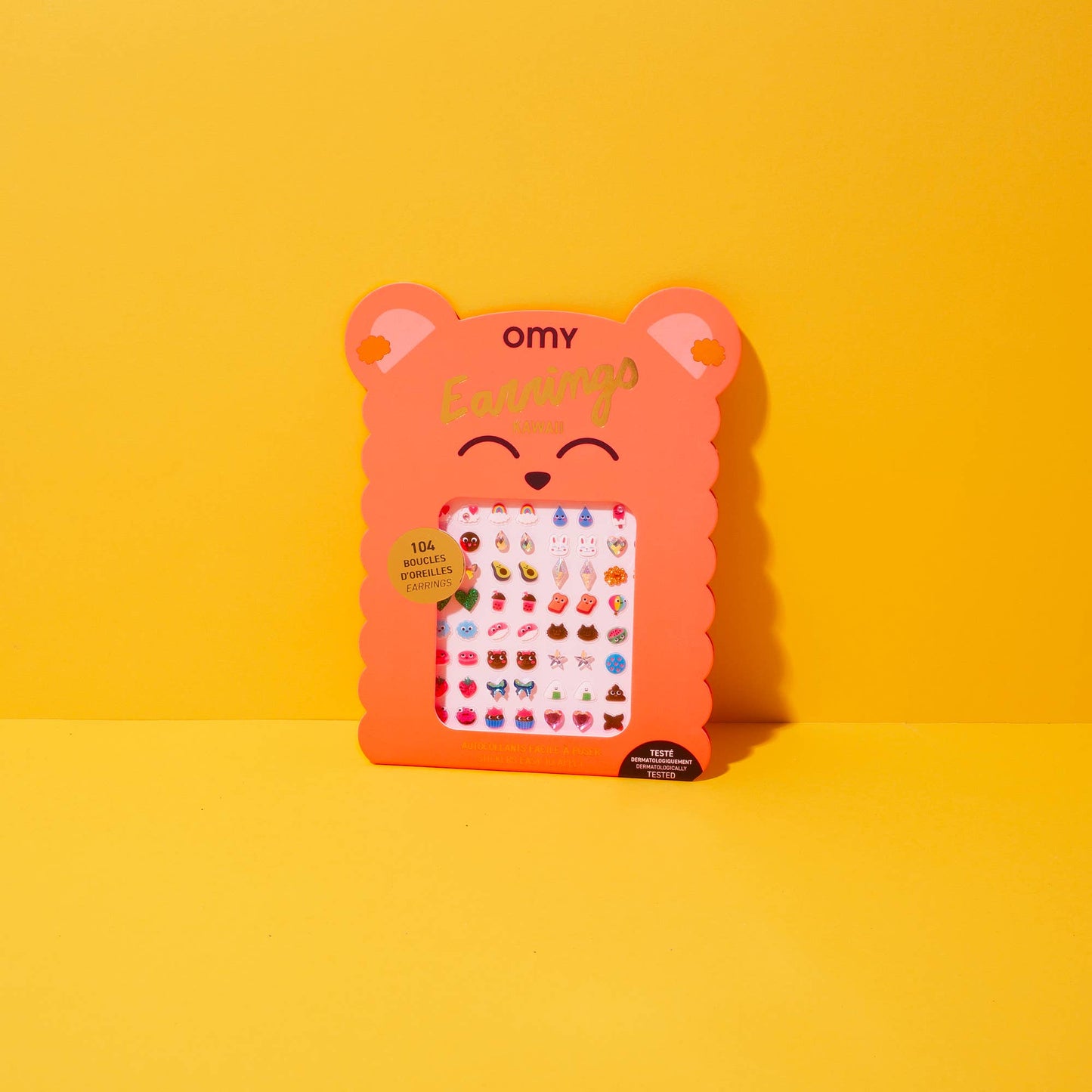 OMY - Kids Sticker Earrings - Kawaii, on a yellow background