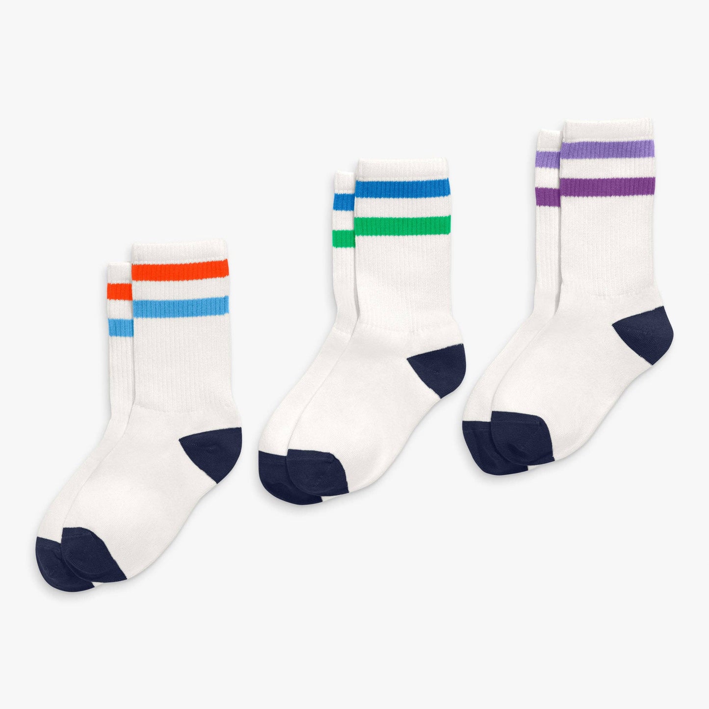 Three pairs of socks with colorful stripes on a white background