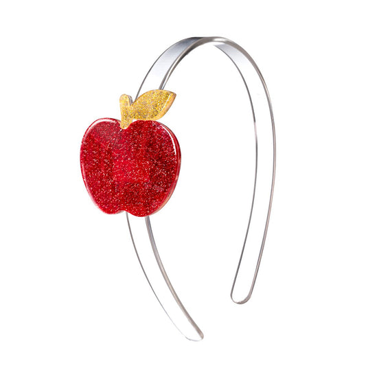 Headband with a red apple-shaped decoration on a white background