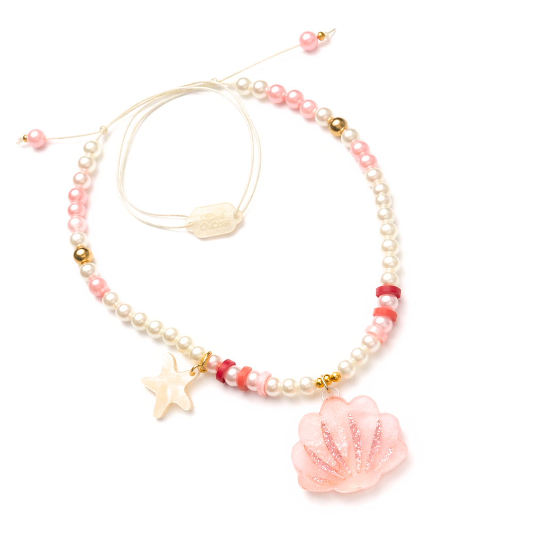 Beaded necklace with shell and starfish charms on a white background