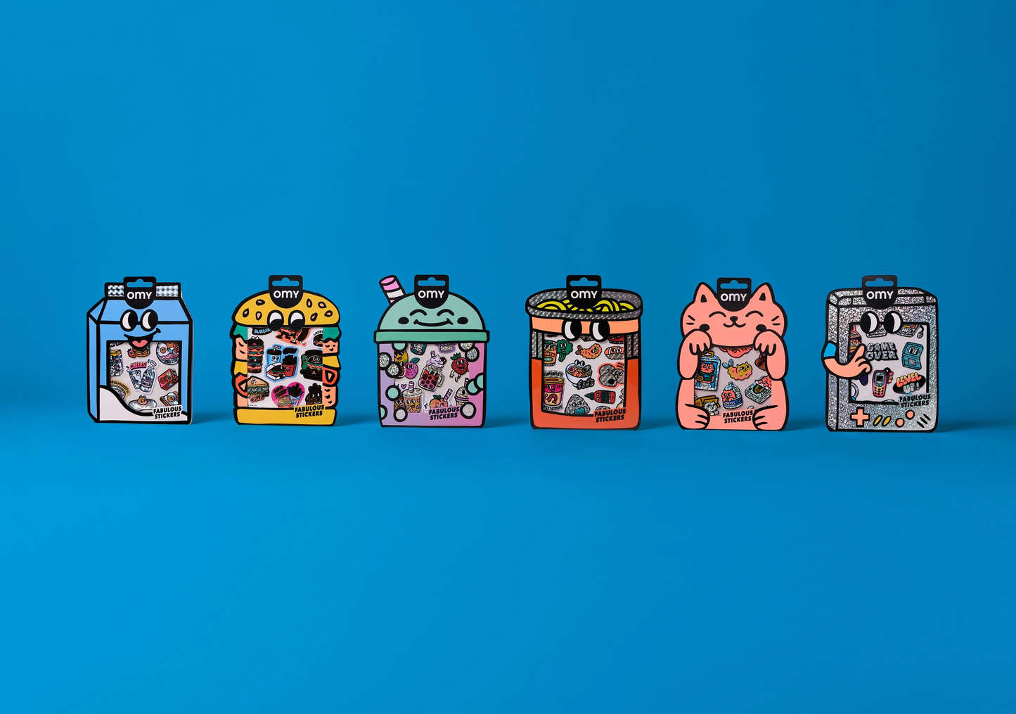 Set of colorful sticker sets in packaging on a blue background