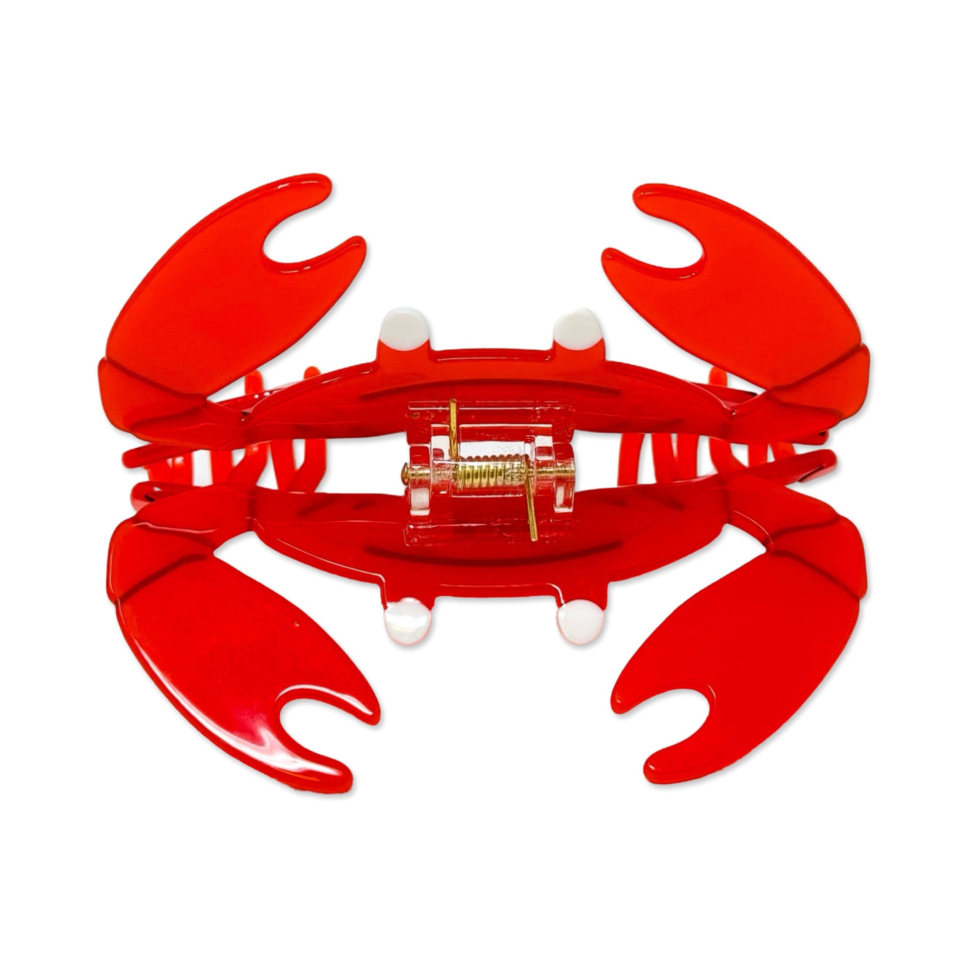 Red crab-shaped hair claw on a white background