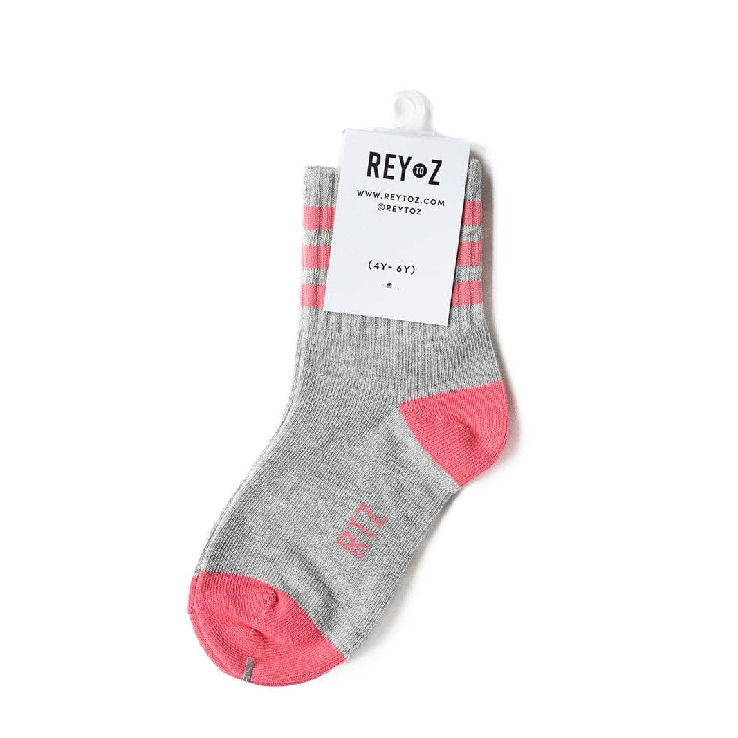 Gray sock with pink accents and REYoz label on a white background