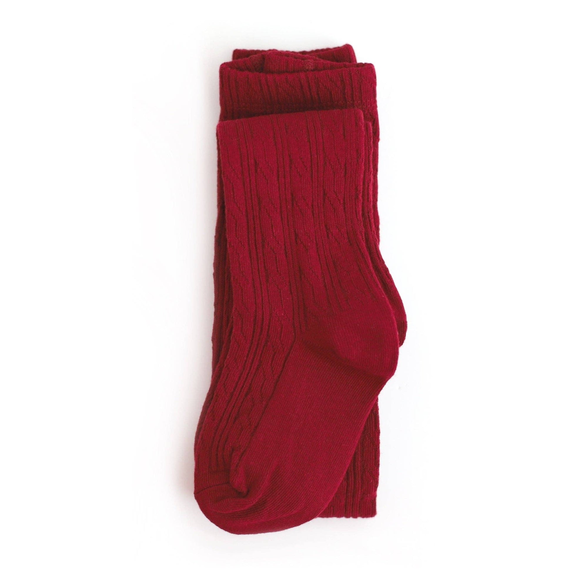 Folded red tights on a white background