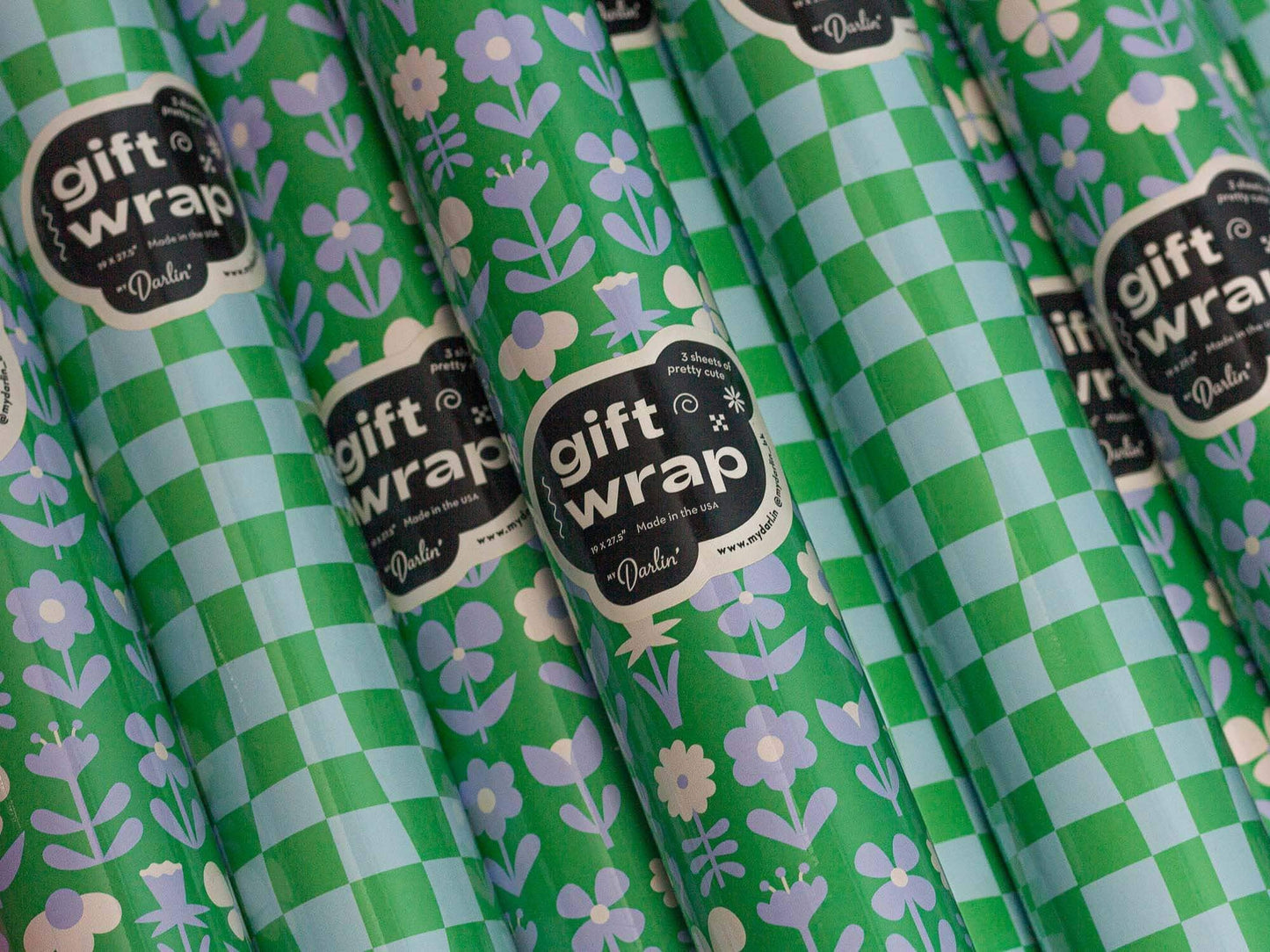 Green and white checkered gift wrap with floral patterns and 'gift wrap' labels.