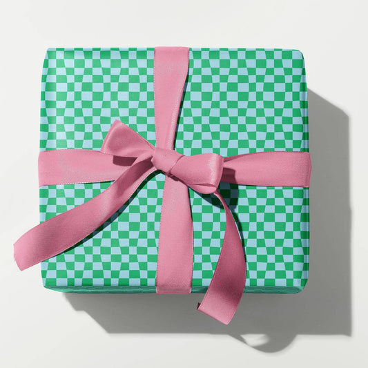 Green checkered gift box with a pink ribbon on a white background