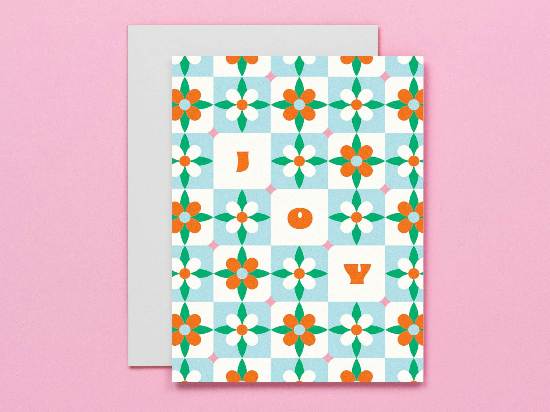 Greeting card with floral pattern and letters on a pink background