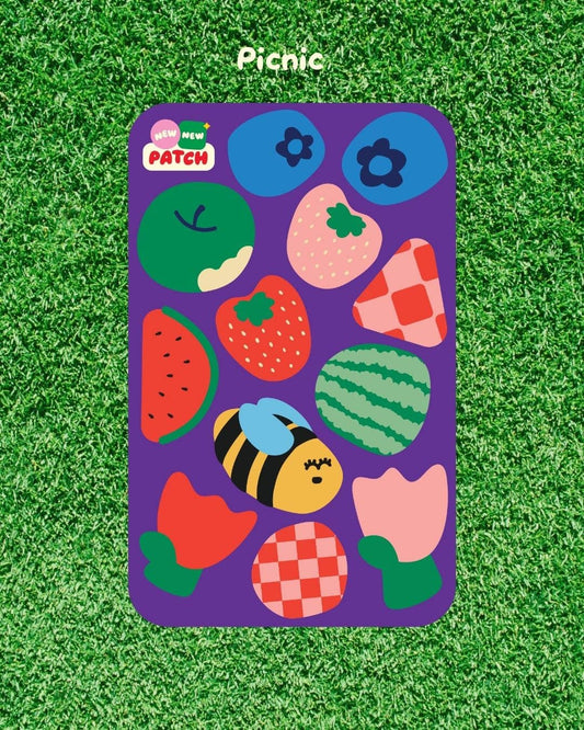 Colorful children's sticker sheet with various shapes and a bee design on a green grass background.