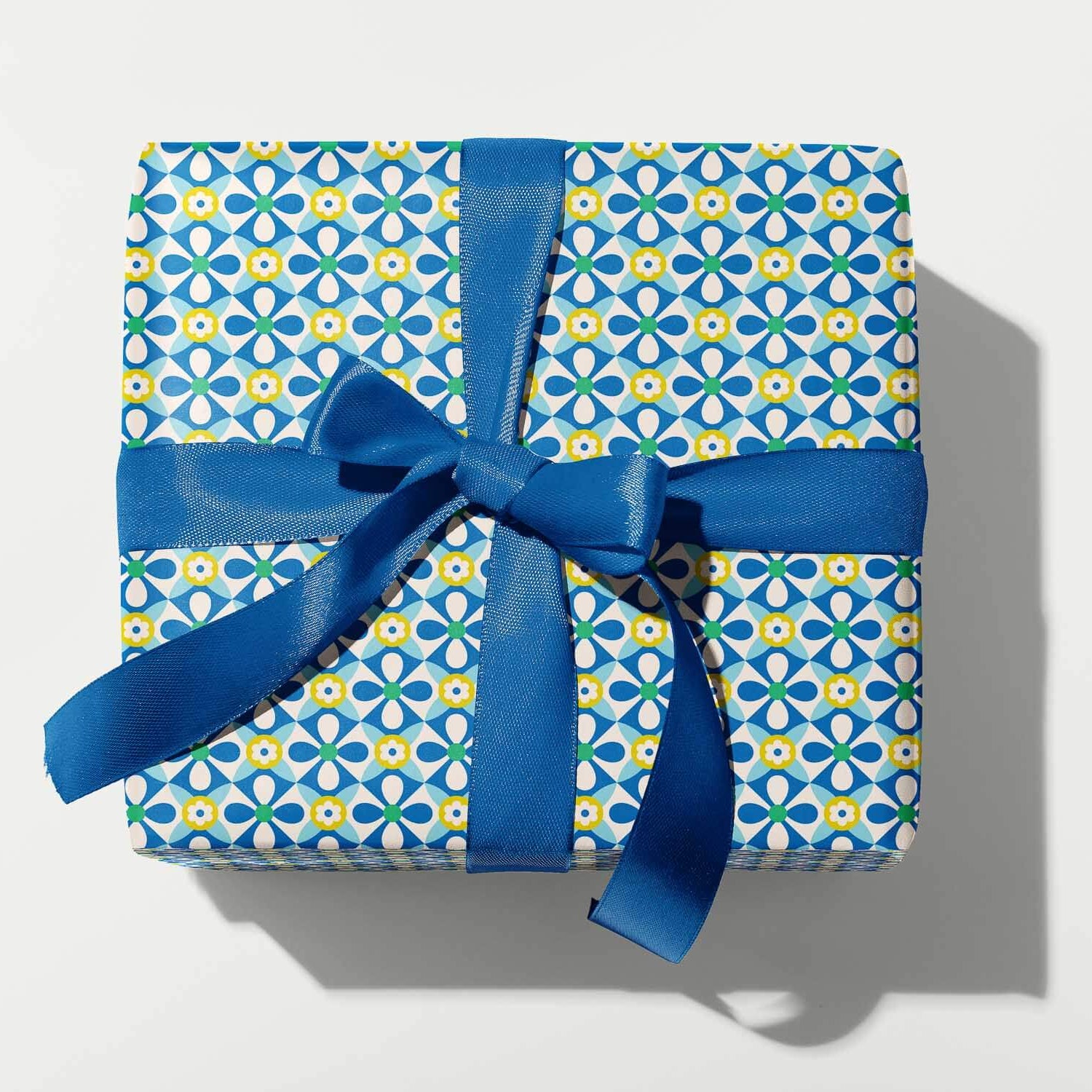 Gift box with blue ribbon on a white background