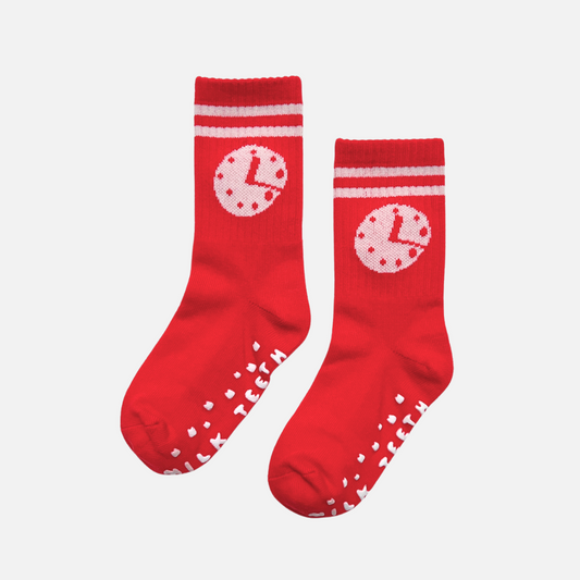 Red socks with white patterns on a light gray background