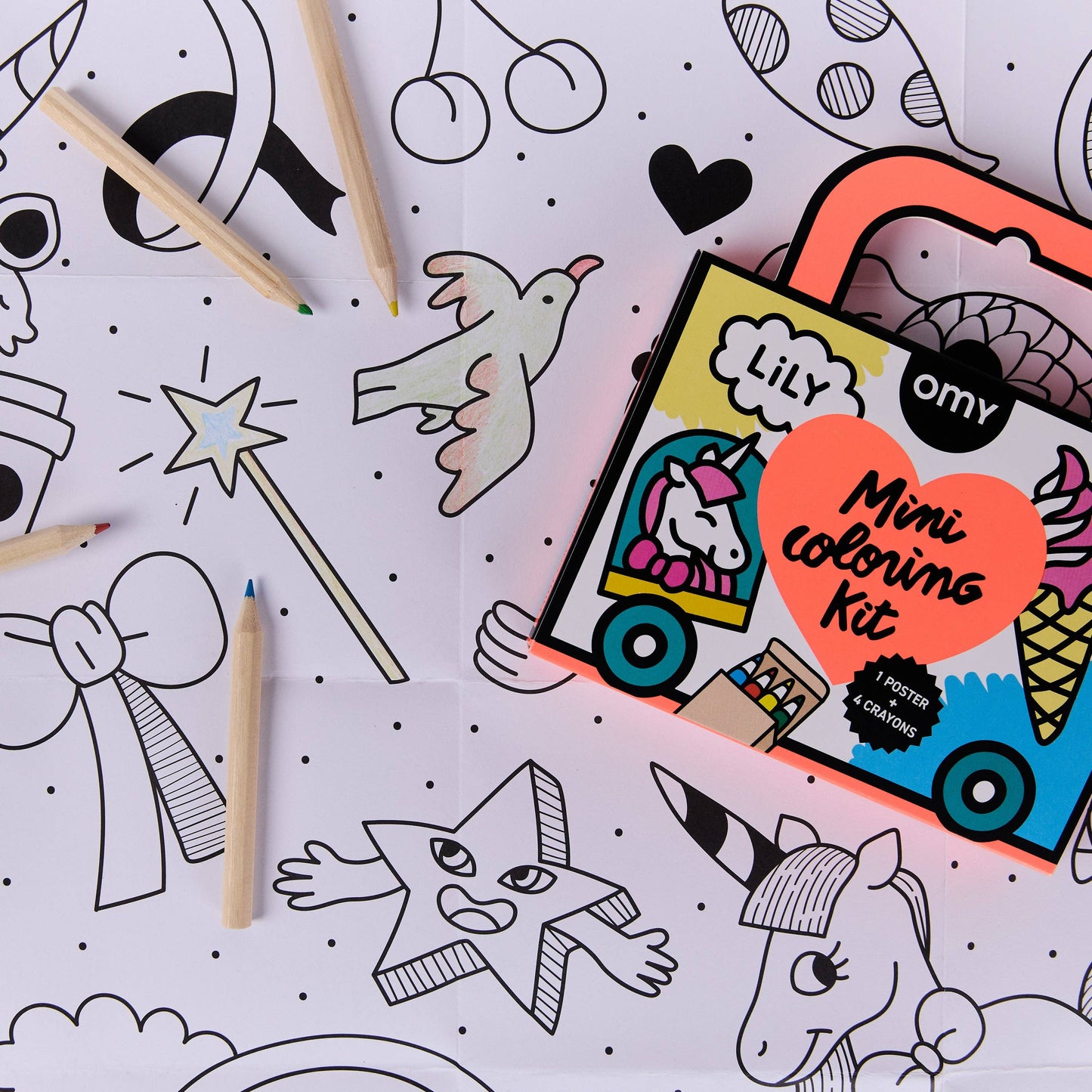 Coloring kit with pencils and coloring book pages on a white background