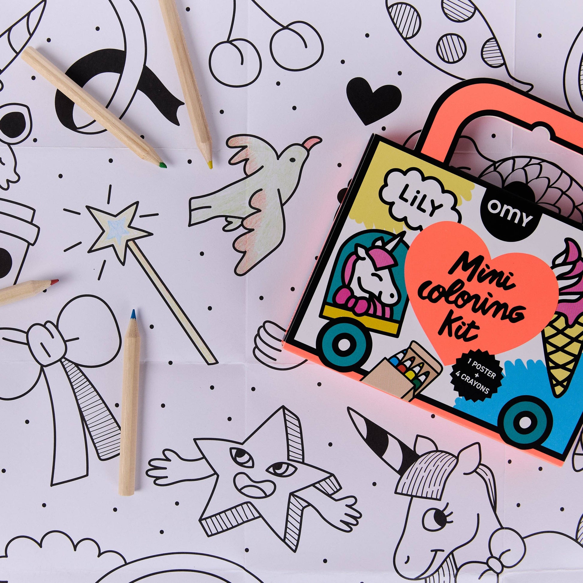 Coloring kit with pencils and coloring book pages on a white background