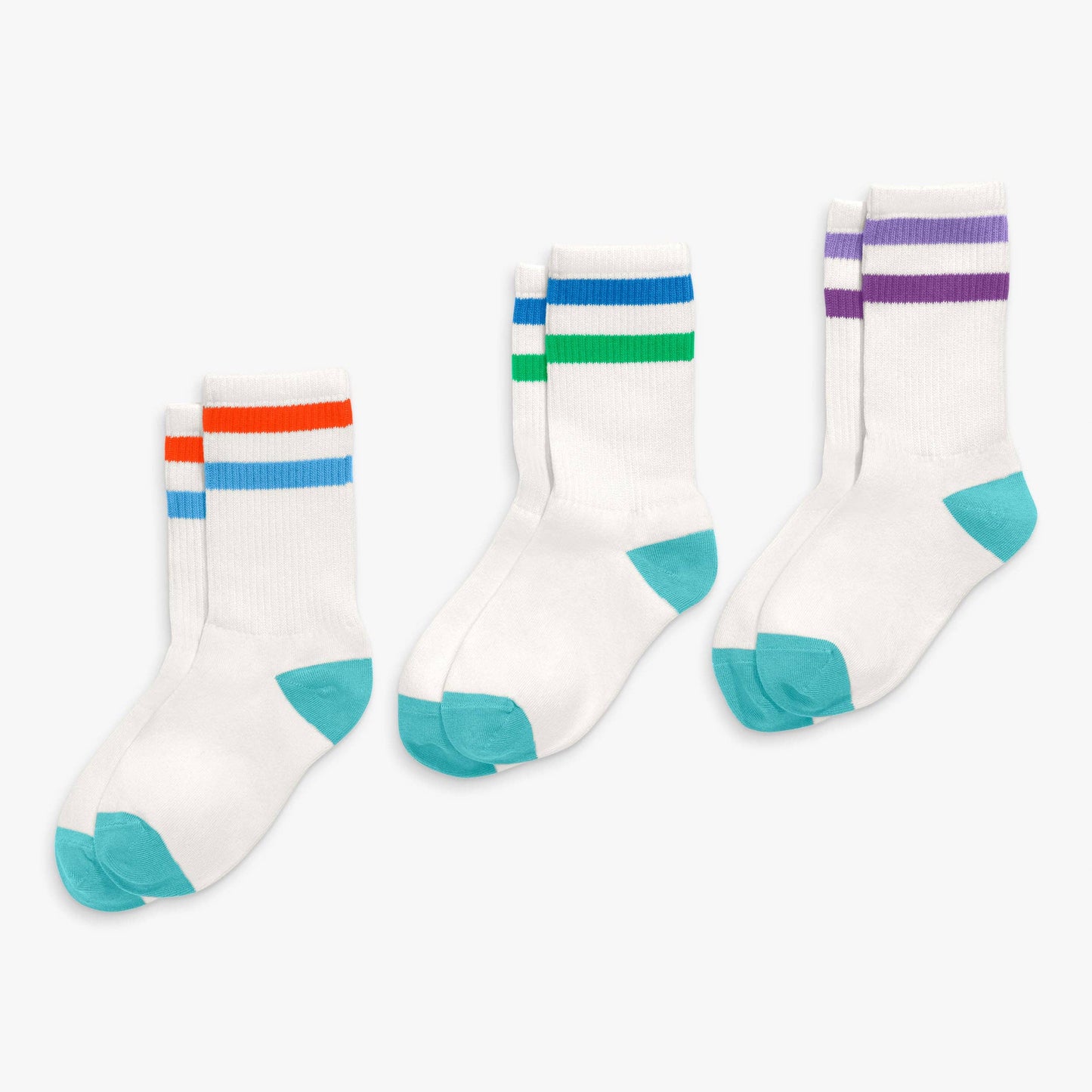Three pairs of socks with colorful stripes on a white background