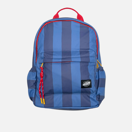 A child's backpack featuring vertical blue and navy stripes with red accents on the top handle, zipper trim, and drawstring cords, shown against a light gray background.